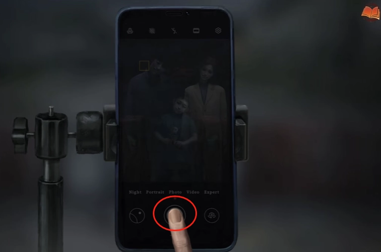 Tap the phone on the tripod to take their photo. You will receive Joss Money afterward.